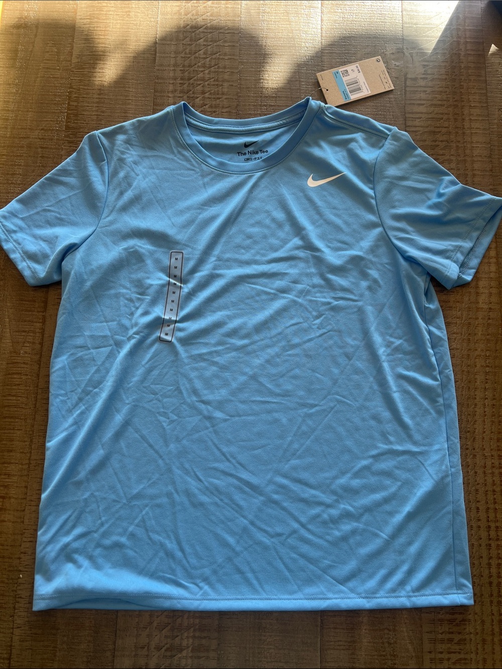 Nike women’s Sky Blue Performance Dri-FIT Tee with White Swoosh